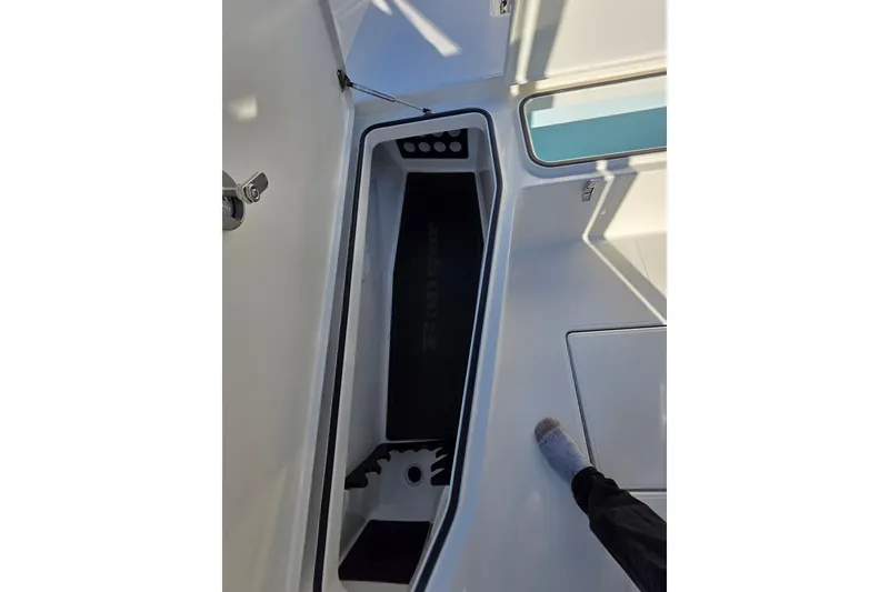 Slide: The Image of Interior view of 2026 Ranger 2360 Bay boat storage compartment. - 11