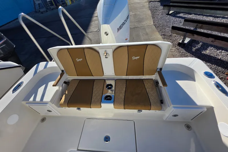 Slide: The Image of 2026 Ranger 2360 Bay boat with tan seating and Mercury engine. - 20