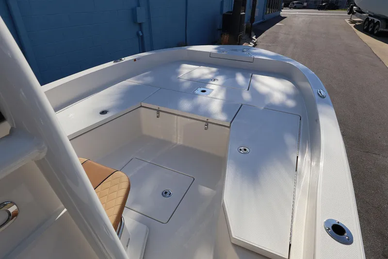 Slide: The Image of 2026 Ranger 2360 Bay boat interior with seating and storage compartments. - 22