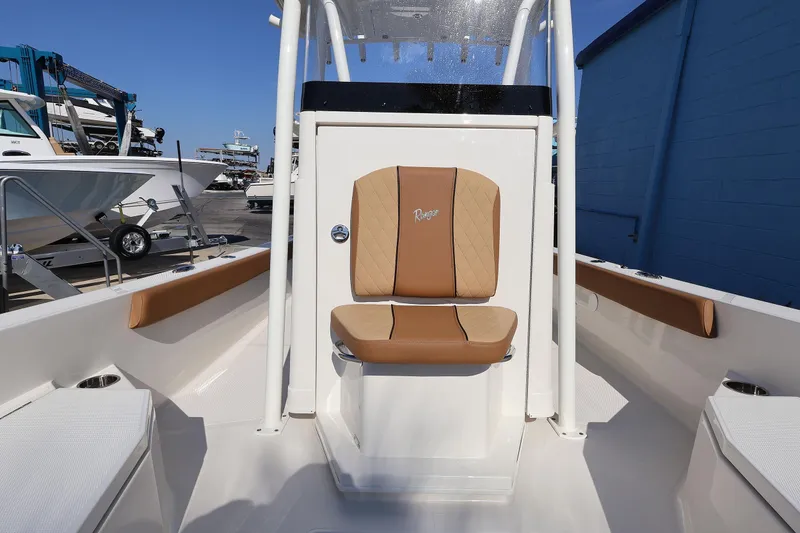 Slide: The Image of 2026 Ranger 2360 Bay boat interior with tan seating and console. - 30
