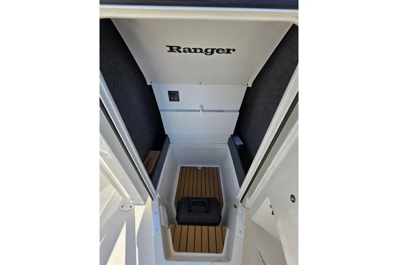Slide: The Image of Interior view of 2026 Ranger 2360 Bay boat storage compartment with wood flooring. - 32