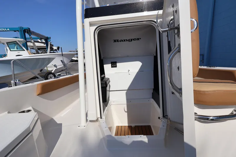 Slide: The Image of 2026 Ranger 2360 Bay boat interior with open storage compartment and seating. - 41