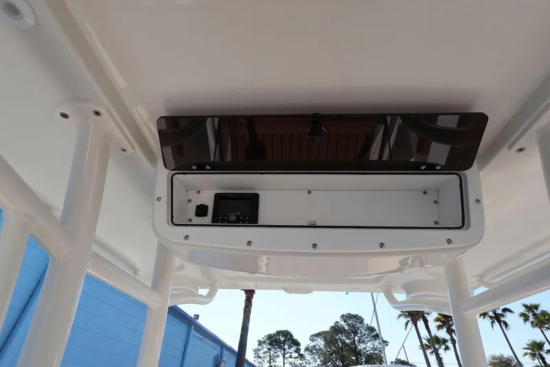 Slide: The Image of 2026 Ranger 2360 Bay boat console with storage compartment, viewed from below. - 44