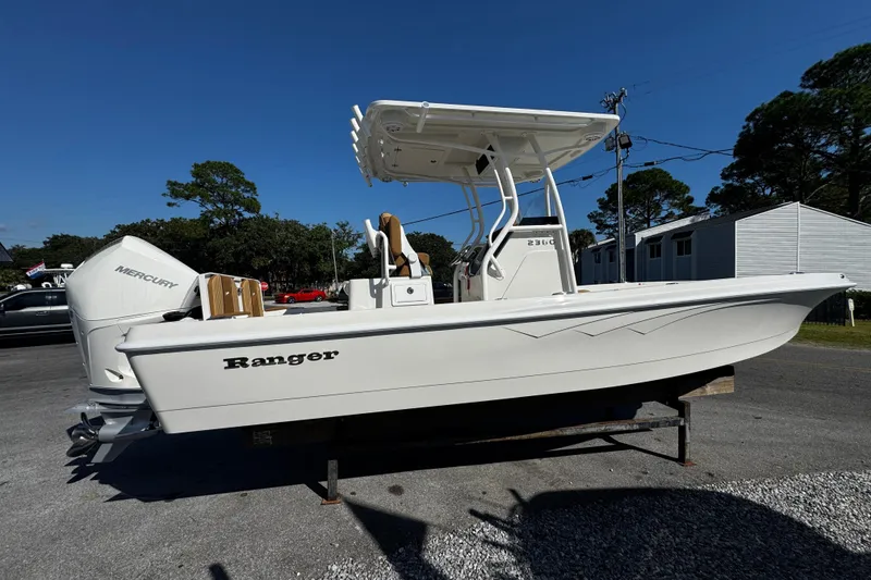 Slide: The Image of 2026 Ranger 2360 Bay boat with Mercury engine on display outdoors. - 5