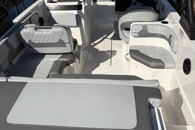 Slide: The Image of 2024 Bayliner VR6 Bowrider OB interior with gray seating and modern design. - 5