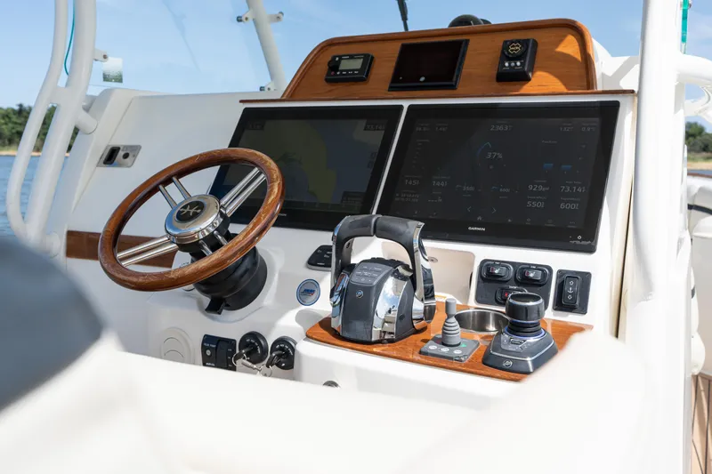 Slide: The Image of 2019 Hunt Yachts 32CC helm with advanced navigation and control systems. - 17