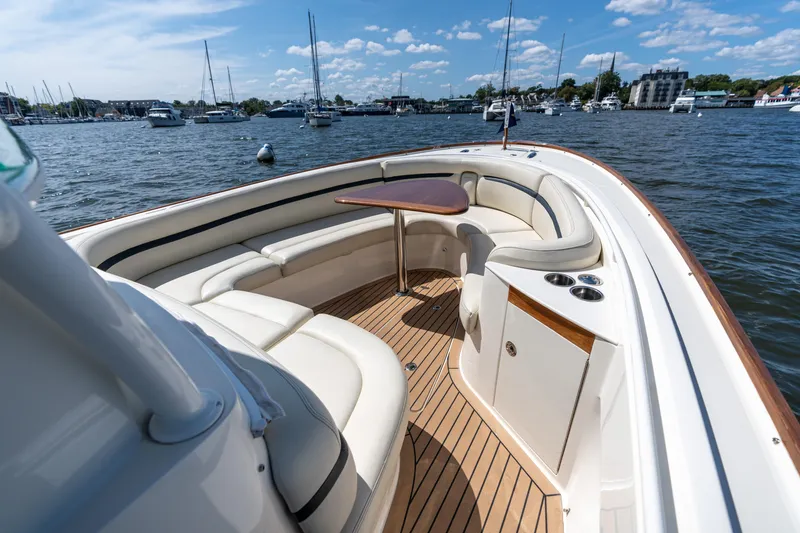 Slide: The Image of Luxurious 2019 Hunt Yachts 32CC boat interior with elegant seating and wooden deck. - 30