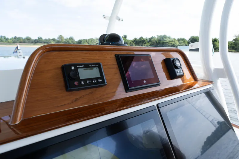 Slide: The Image of Control panel of 2019 Hunt Yachts 32CC with navigation and audio systems. - 18