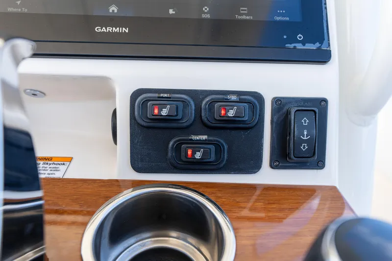 Slide: The Image of Control panel of 2019 Hunt Yachts 32CC with Garmin display and cup holder. - 19