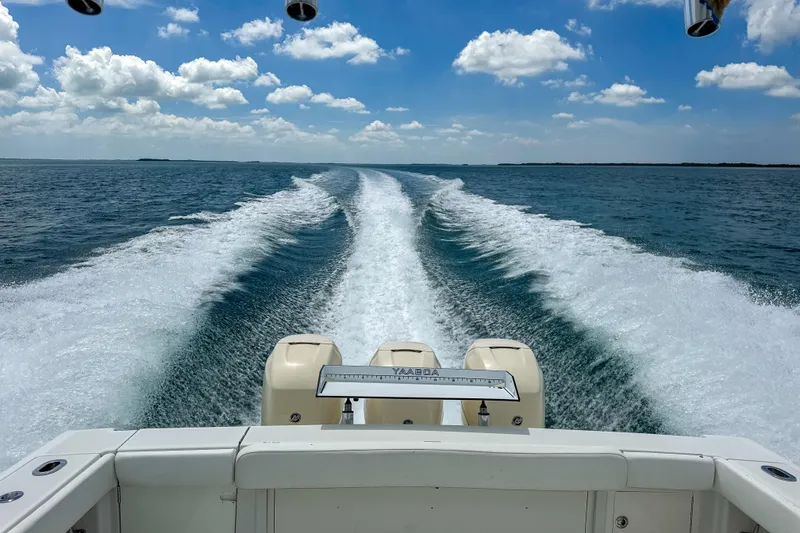 Slide: The Image of Jupiter 39 Express 2009 boat cruising on open water, leaving a wake trail. - 12