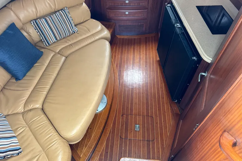 Slide: The Image of Interior of 2009 Jupiter 39 Express with leather seating and wooden flooring. - 24