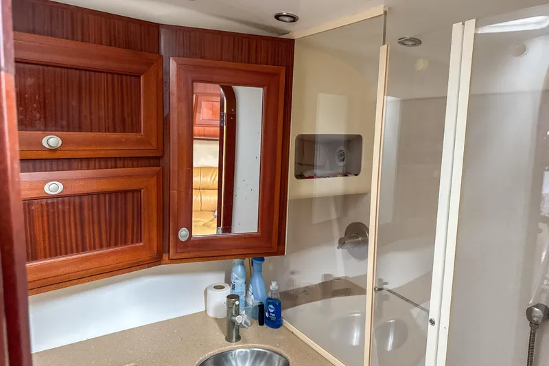 Slide: The Image of 2009 Jupiter 39 Express bathroom with wooden cabinets and modern fixtures. - 25