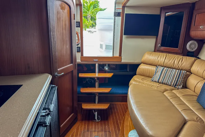 Slide: The Image of Interior of 2009 Jupiter 39 Express yacht with leather seating and wooden accents. - 26