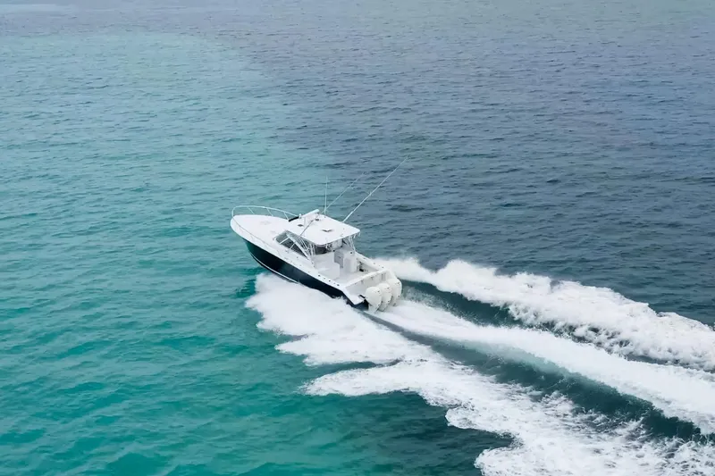 Slide: The Image of 2009 Jupiter 39 Express boat cruising on clear blue ocean waters. - 4