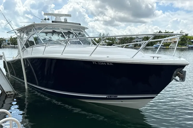 Slide: The Image of 2009 Jupiter 39 Express boat docked on a sunny day, featuring sleek design and modern equipment. - 5