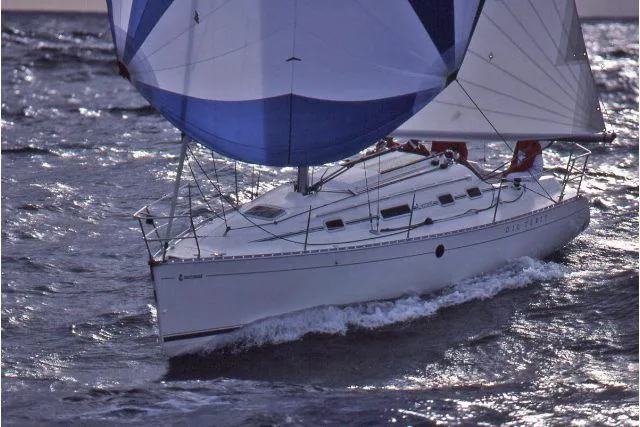 The Image of Sailing yacht Beneteau First 310, 1993 model, navigating through ocean waves. - 0