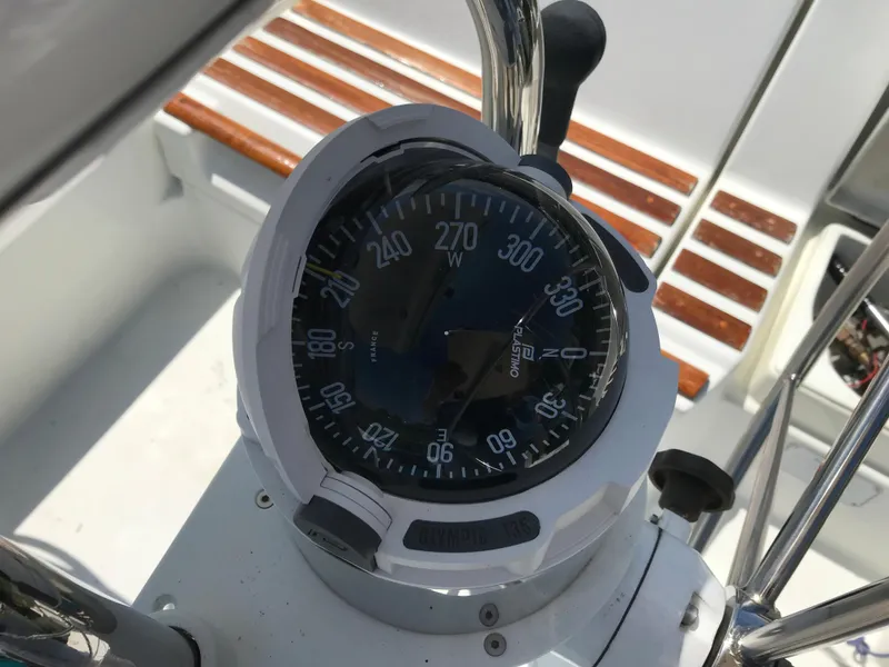 Slide: The Image of Compass on 1993 Beneteau First 310 sailboat, showing navigation details. - 14