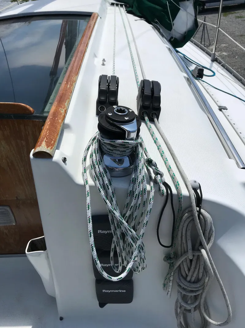 Slide: The Image of Deck of 1993 Beneteau First 310 sailboat with winch and ropes. - 17