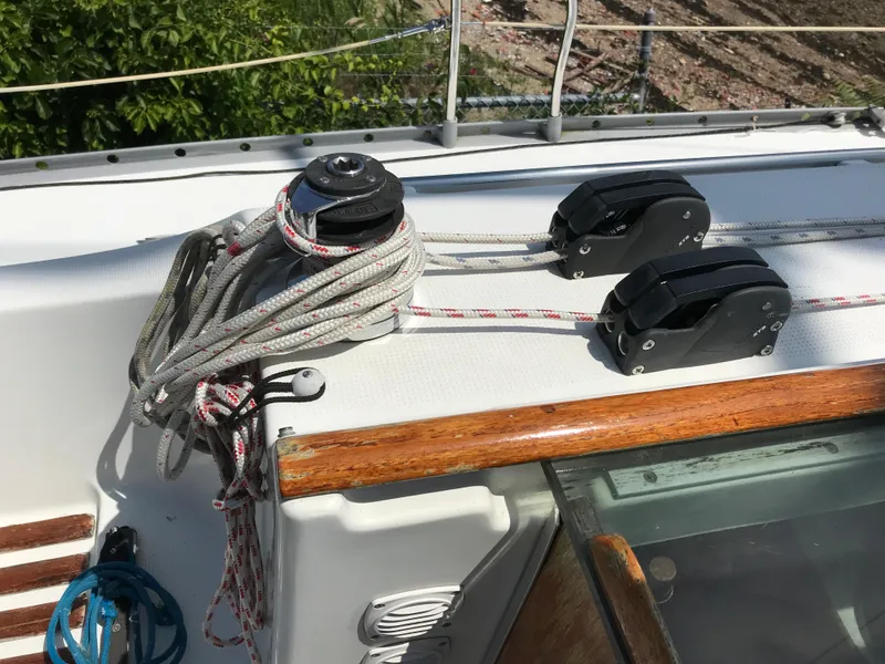 Slide: The Image of Deck of 1993 Beneteau First 310 sailboat with ropes and pulleys. - 19