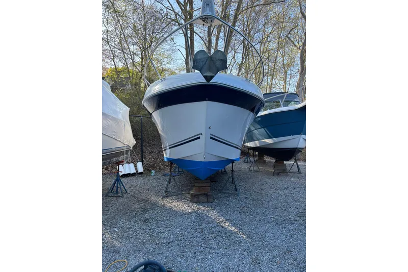 Slide: The Image of 2004 Four Winns 268 Vista boat on stands, surrounded by trees. - 30