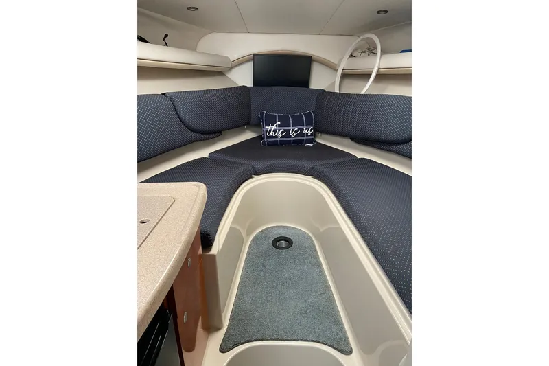 Slide: The Image of Interior of 2004 Four Winns 268 Vista boat with cozy seating and cushion. - 47