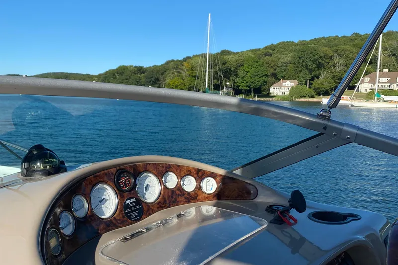 Slide: The Image of 2004 Four Winns 268 Vista boat dashboard with scenic lake view. - 67
