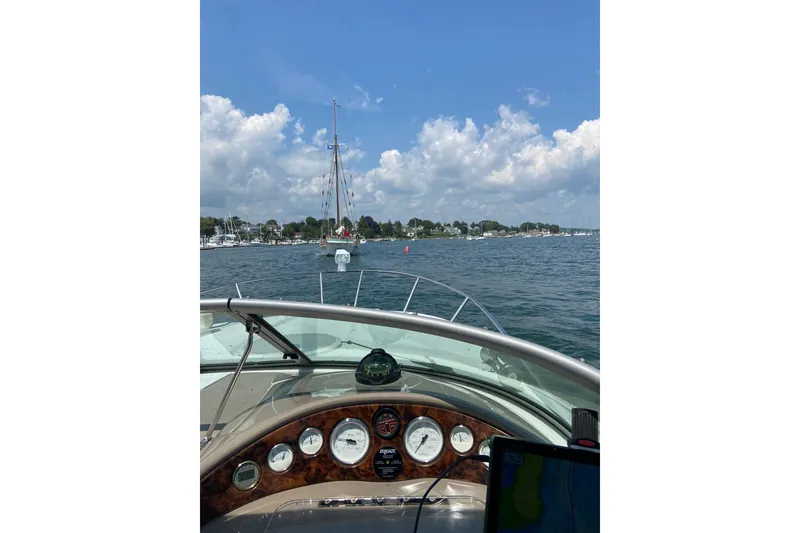Slide: The Image of 2004 Four Winns 268 Vista boat dashboard view on a sunny day at sea. - 72