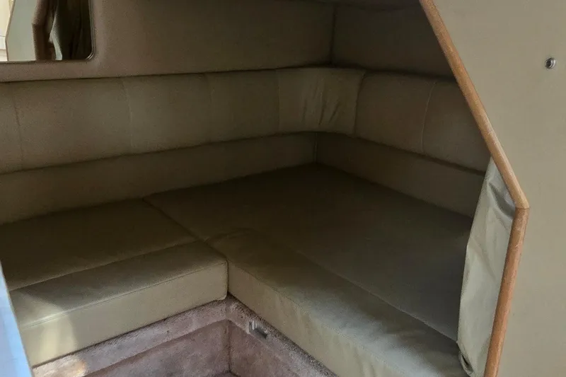 Slide: The Image of Interior cabin of 1998 Sea Ray 330 Sundancer with beige seating. - 19