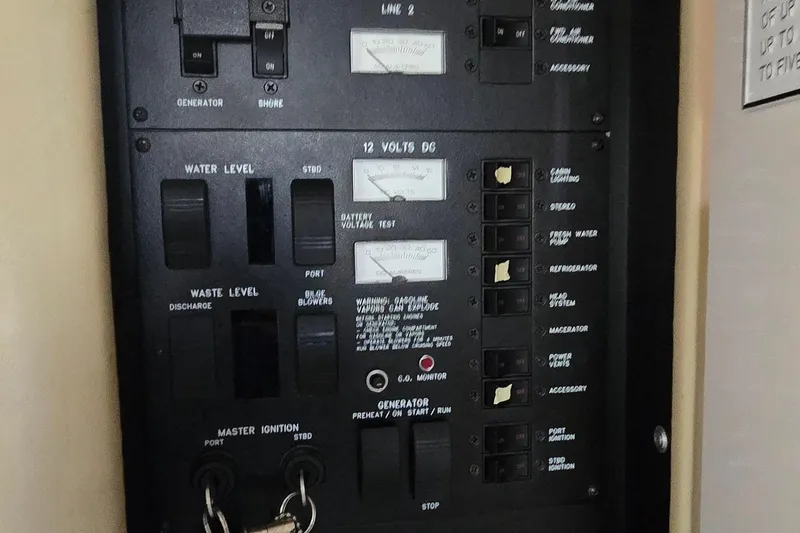 Slide: The Image of Electrical control panel on a 1998 Sea Ray 330 Sundancer boat. - 23