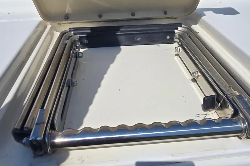 Slide: The Image of Stainless steel swim ladder on 1998 Sea Ray 330 Sundancer boat. - 32