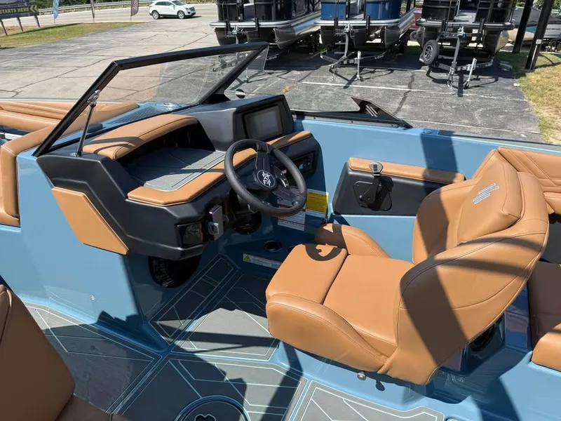 Slide: The Image of 2026 ATX Surf Boats 22 Type-S interior with tan seats and modern dashboard. - 10