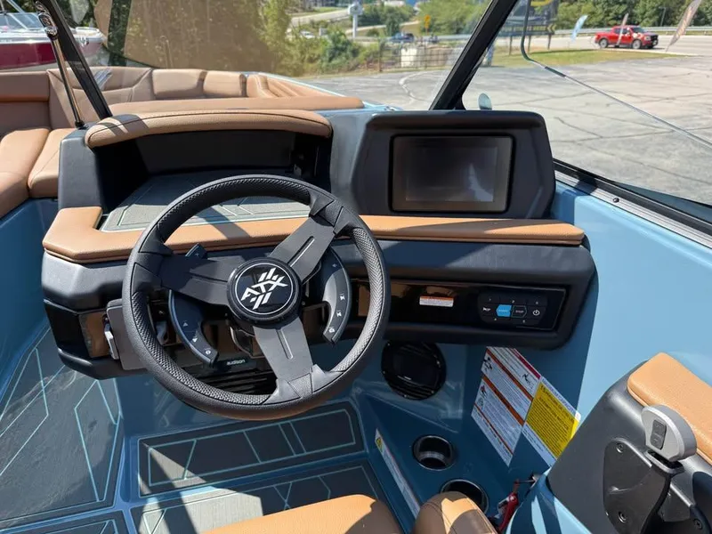 Slide: The Image of 2026 ATX Surf Boats 22 Type-S dashboard with steering wheel and touchscreen display. - 11
