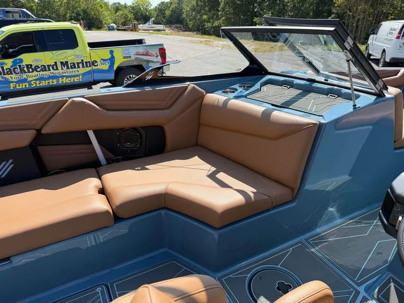 Slide: The Image of 2026 ATX Surf Boats 22 Type-S with tan seating and blue interior. - 12