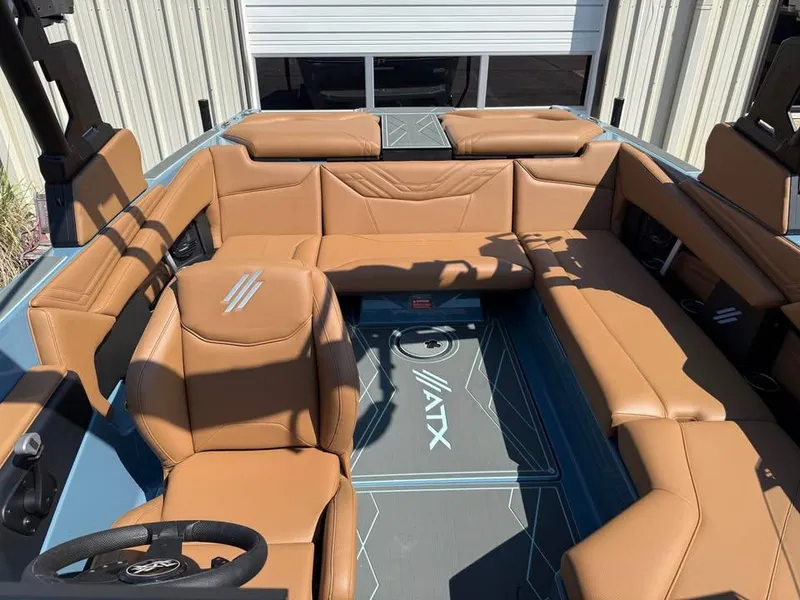 Slide: The Image of 2026 ATX Surf Boats 22 Type-S interior with tan leather seating and modern design. - 14