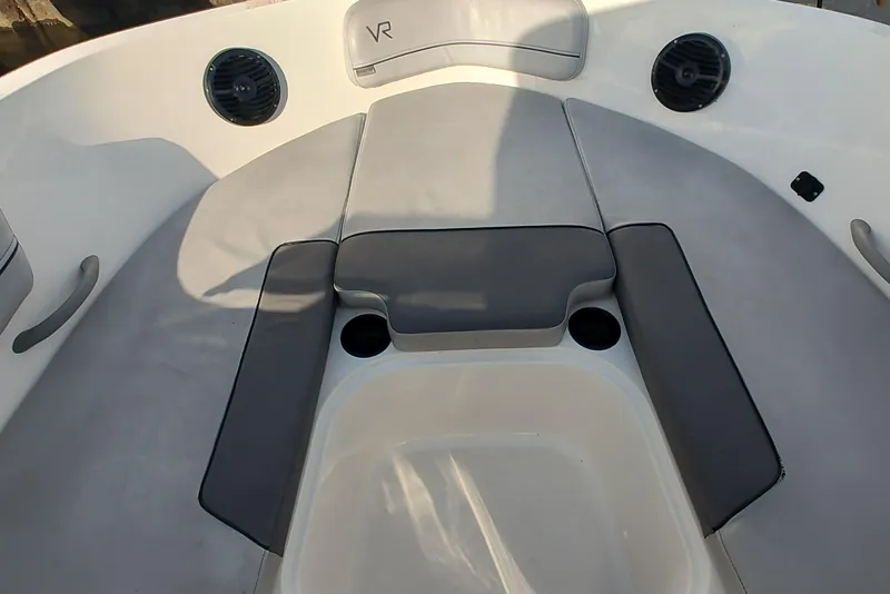 Slide: The Image of 2023 Bayliner VR6 Bowrider OB interior seating with cup holders and speakers. - 10