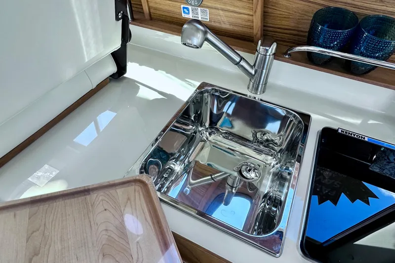 Slide: The Image of Modern kitchen sink and faucet in 2026 Ranger Tugs R-25 boat interior. - 20