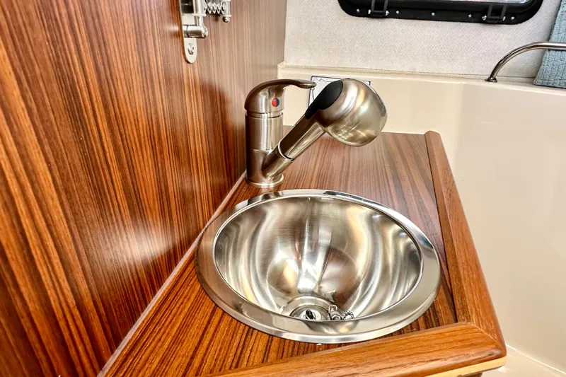 Slide: The Image of Stainless steel sink and faucet in 2026 Ranger Tugs R-25 boat interior. - 33