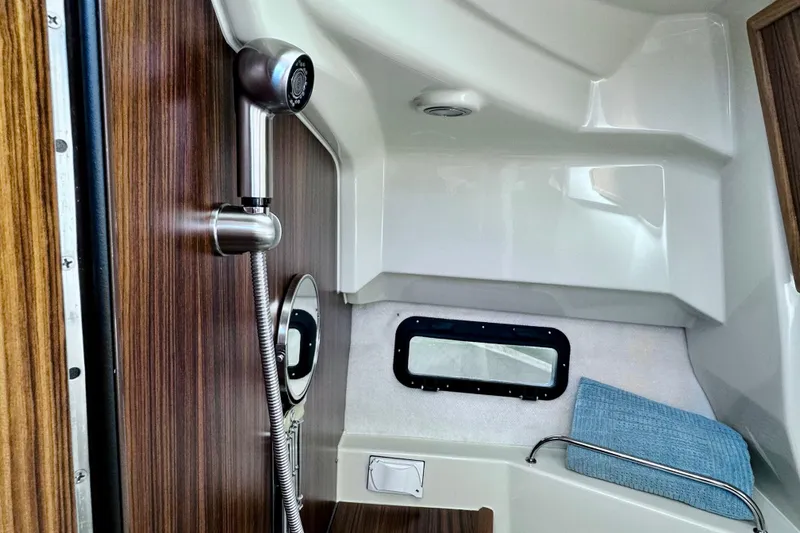 Slide: The Image of Interior of 2026 Ranger Tugs R-25 boat with shower and window. - 35