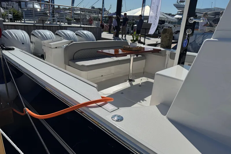 Slide: The Image of NorthCoast 415 HT 2026 model, featuring a sleek deck and comfortable seating area. - 16