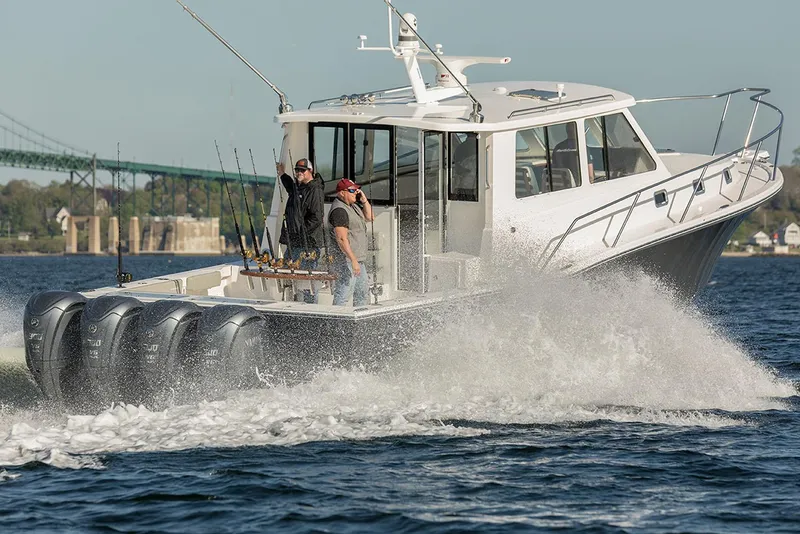 Slide: The Image of Luxurious 2026 NorthCoast 415 HT boat with spacious seating and sleek design at marina. - 2