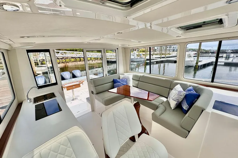 Slide: The Image of 2026 NorthCoast 415 HT boat docked with Yamaha engines, showcasing sleek design. - 4