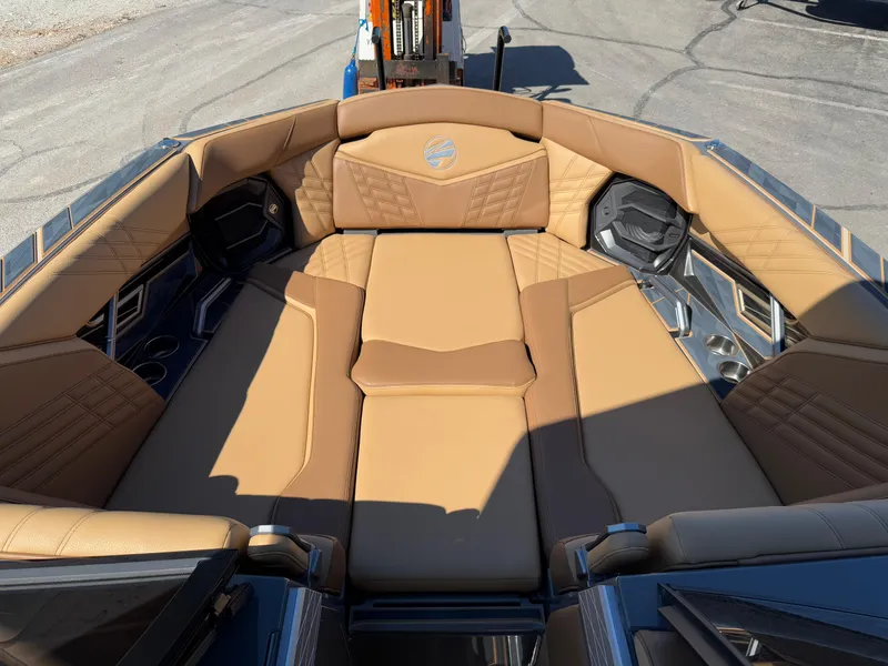 Slide: The Image of Luxurious interior of 2025 Tigé Ultré 25ZX boat with tan leather seating. - 15