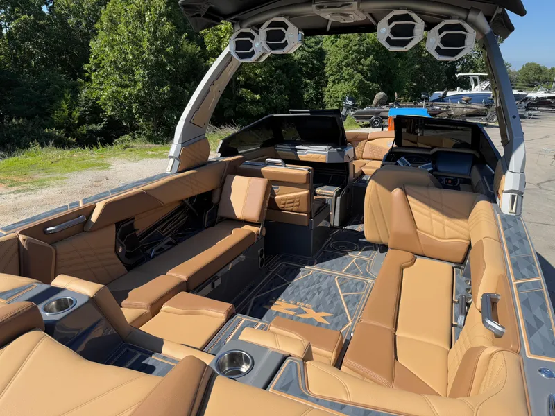 Slide: The Image of 2025 Tigé Ultré 25ZX boat interior with luxurious tan seating and modern design. - 8