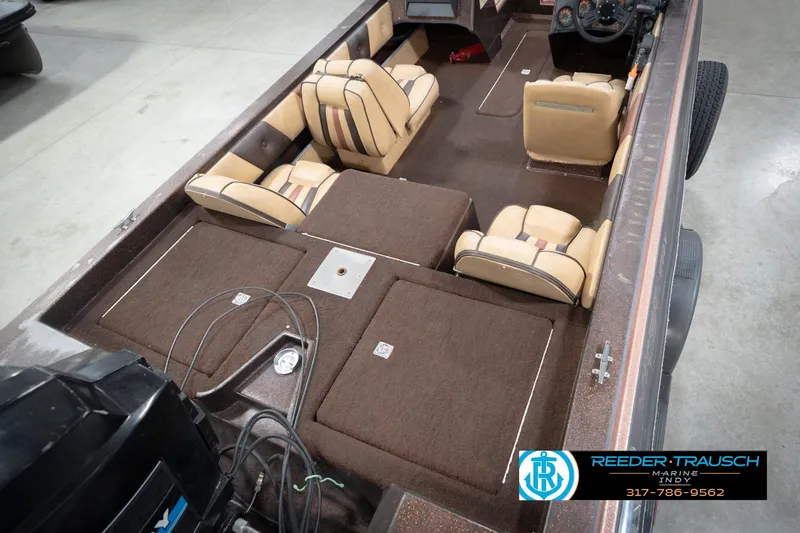 Slide: The Image of 1986 ProCraft 1775 Bass boat interior with tan seats and brown carpet. - 13