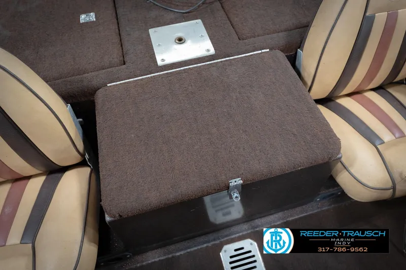 Slide: The Image of 1986 ProCraft 1775 Bass boat interior with brown carpet and striped seats. - 21