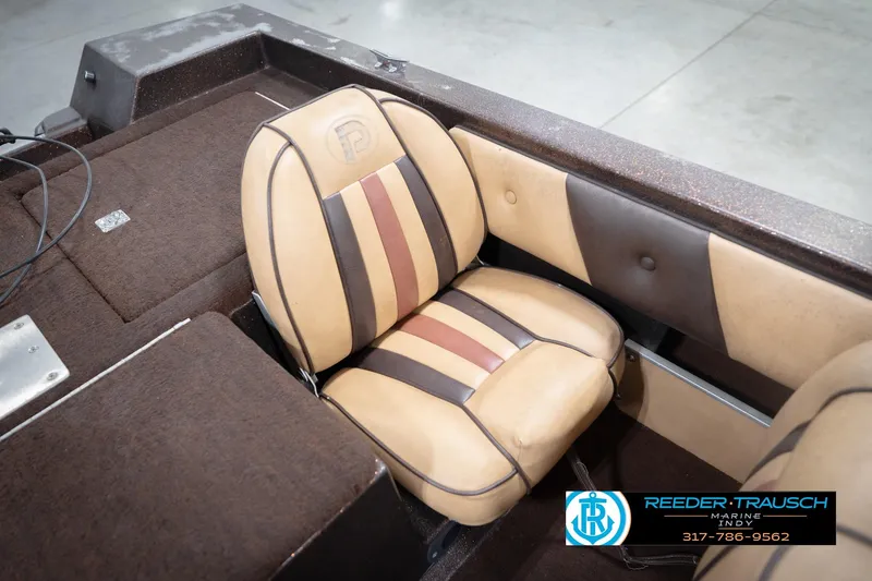 Slide: The Image of 1986 ProCraft 1775 Bass boat interior with tan and brown seating. - 23