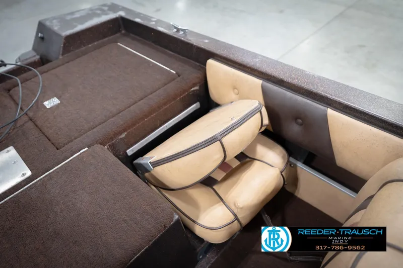 Slide: The Image of 1986 ProCraft 1775 Bass boat interior with tan seats and brown carpet. - 24