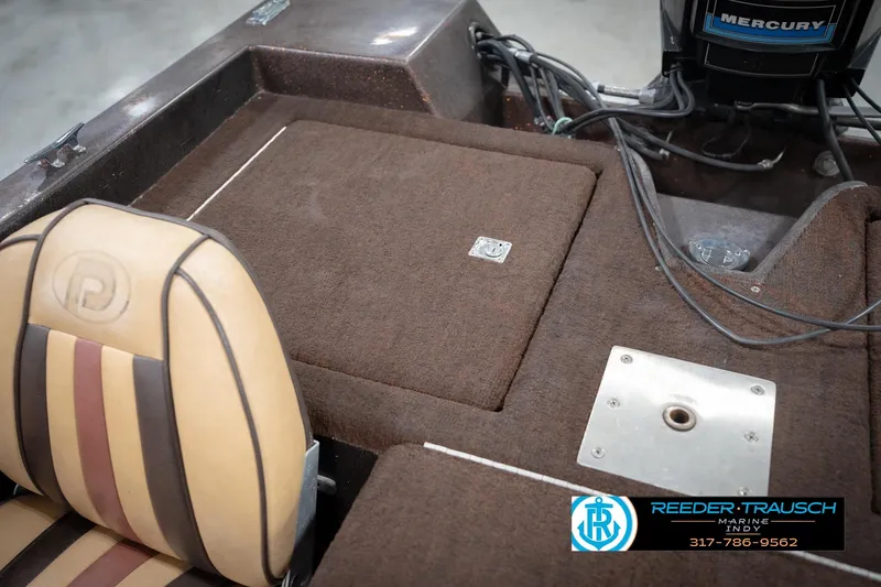 Slide: The Image of 1986 ProCraft 1775 Bass boat interior with Mercury engine and Reeder-Trausch Marine logo. - 26