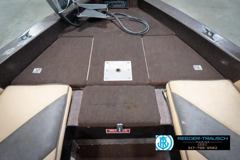 Slide: The Image of 1986 ProCraft 1775 Bass boat interior with brown carpet and seating. - 30