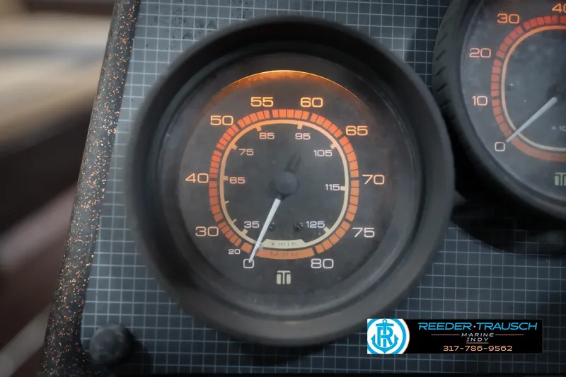 Slide: The Image of Close-up of a 1986 ProCraft 1775 Bass boat speedometer, displaying speed in km/h. - 37
